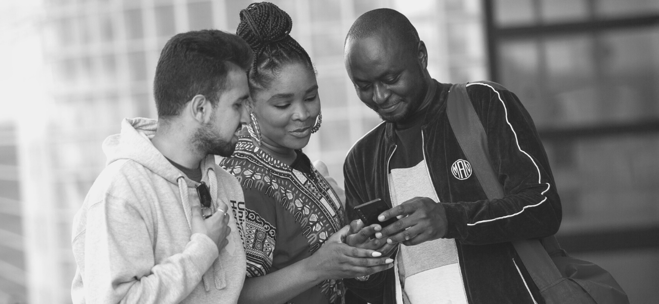 Students looking at news on a phone