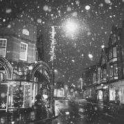 Snow falling in a city centre