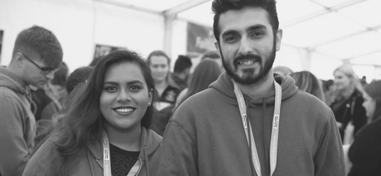 Two students smiling