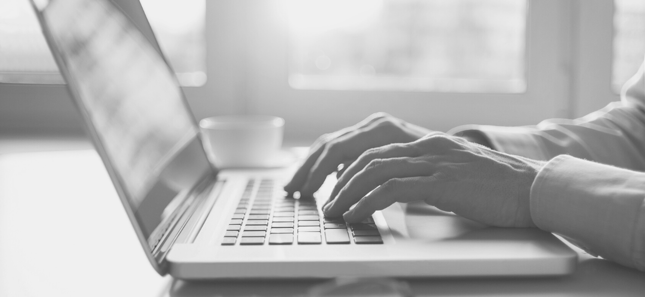 Someone typing on laptop keyboard