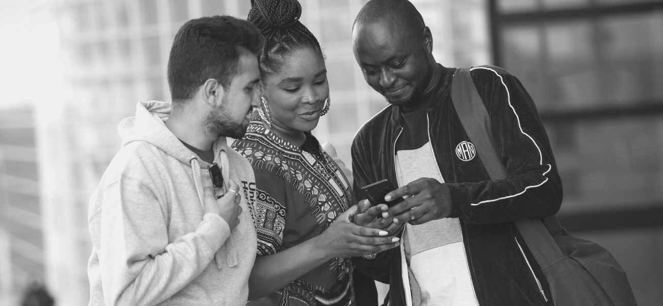 Students looking at a phone