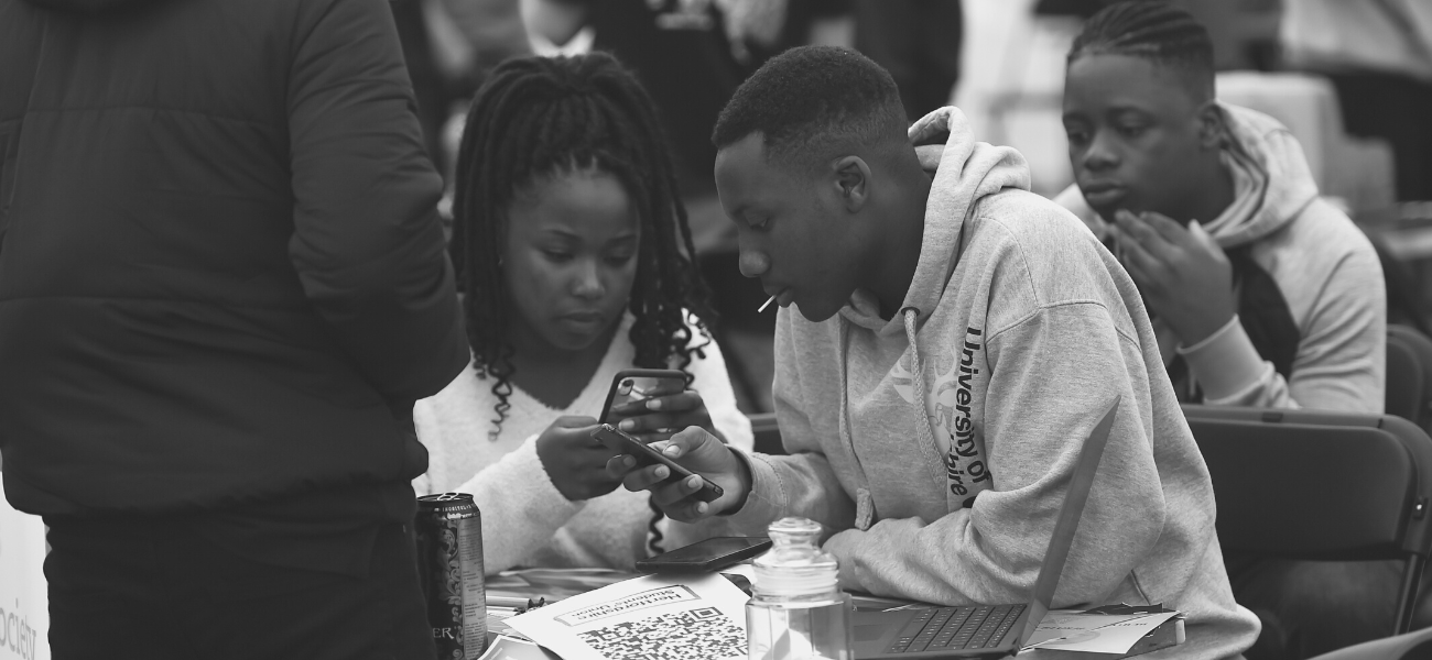 Students looking at a phone