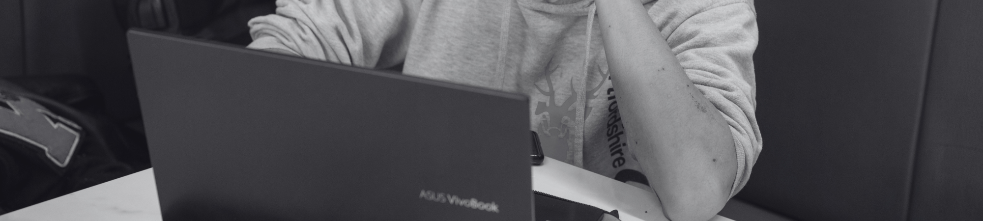 Student typing on laptop