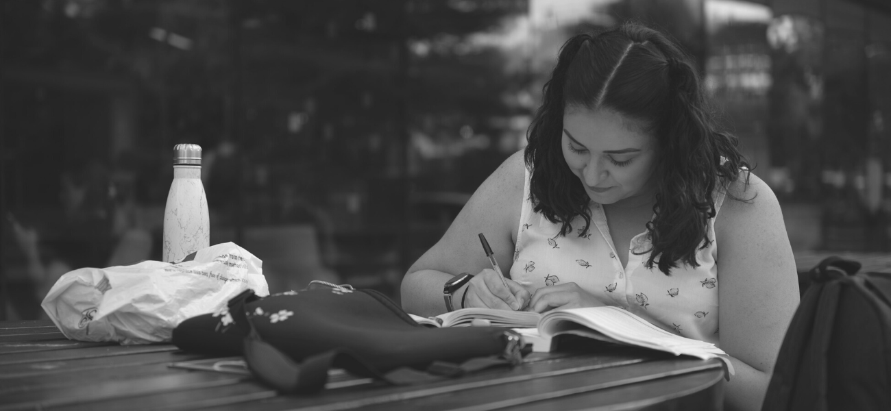 A student studying on campus