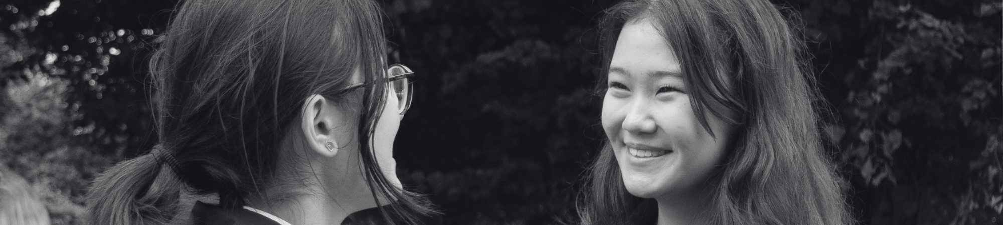 Two students smiling