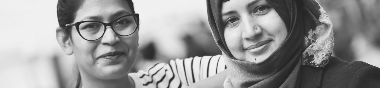 Picture of two students smiling at the camera