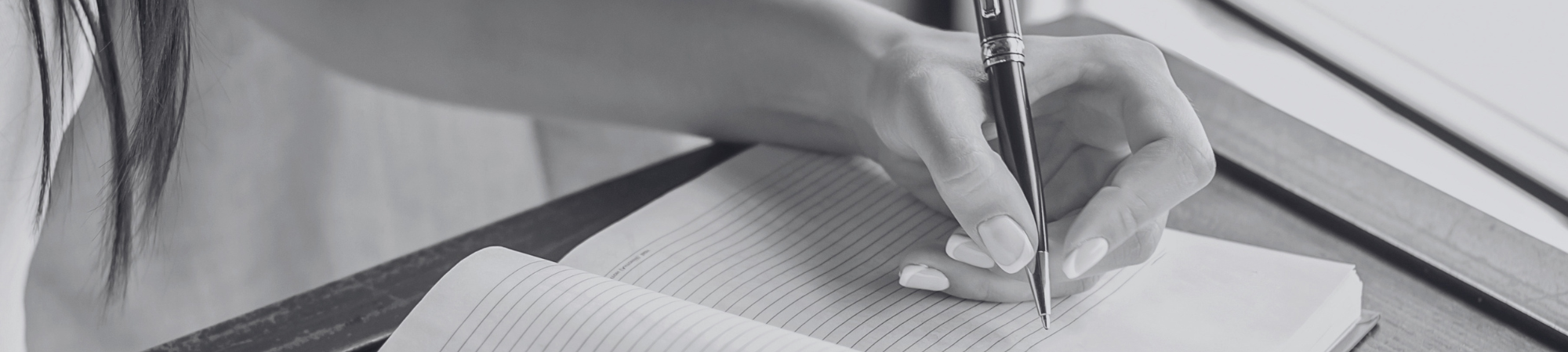 Person writing in a notebook