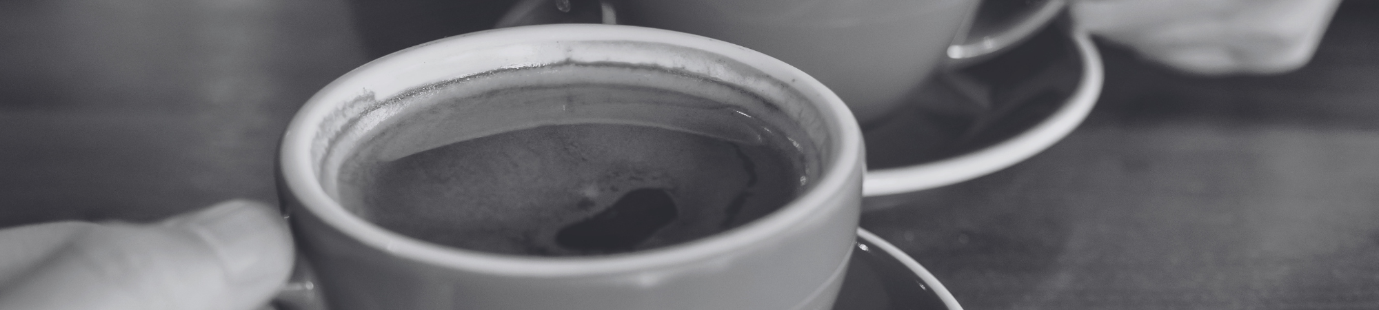 Two cups of coffee on a table