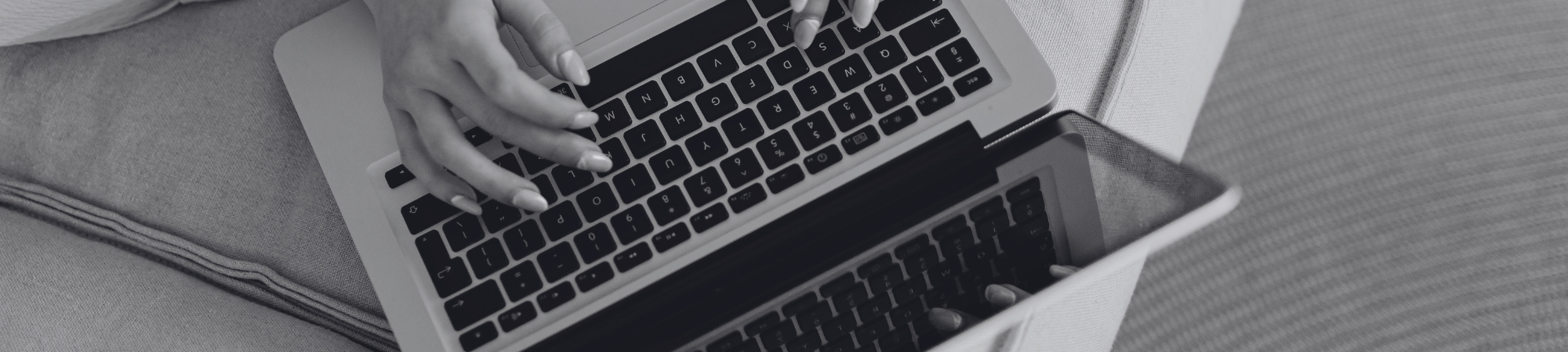 Student typing on laptop