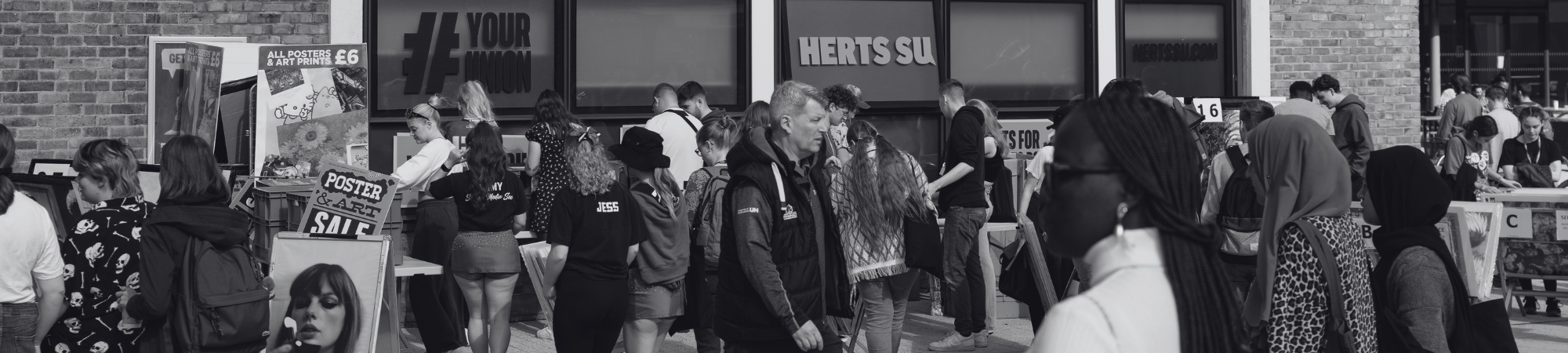 Exterior of Herts SU on College Lane with students in the foreground