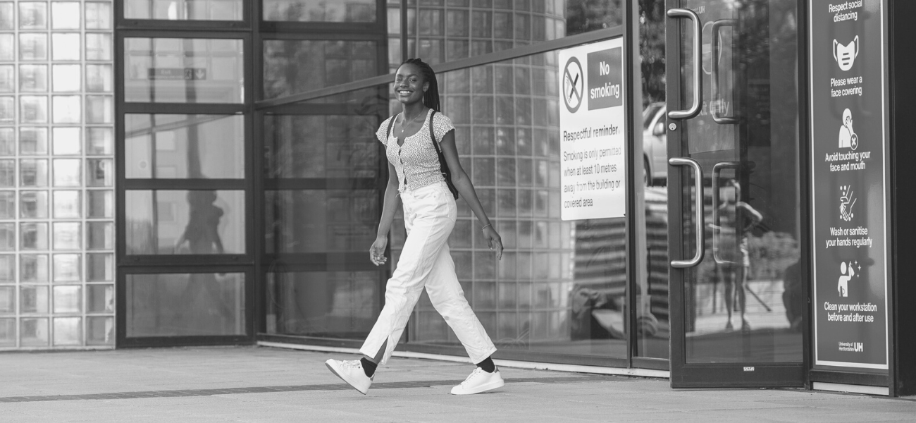 Student leaving the Learning Resources Centre