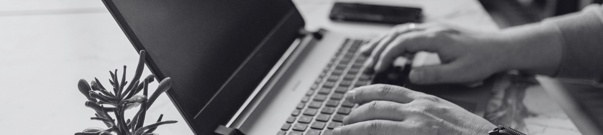 Student typing on laptop