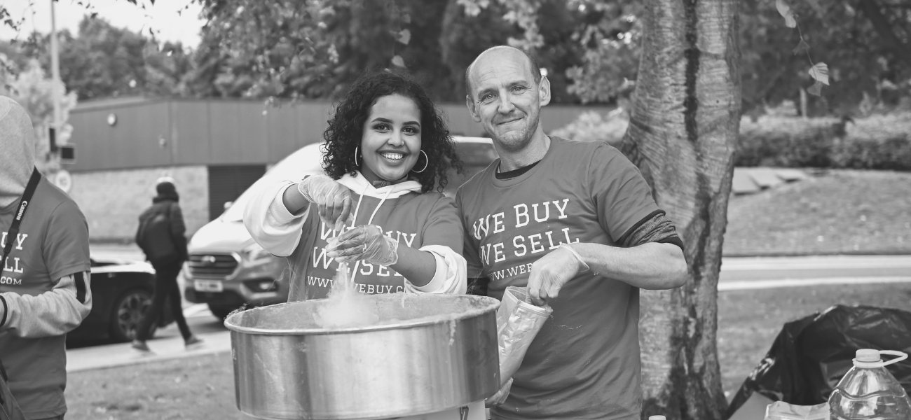 Two people creating candy floss