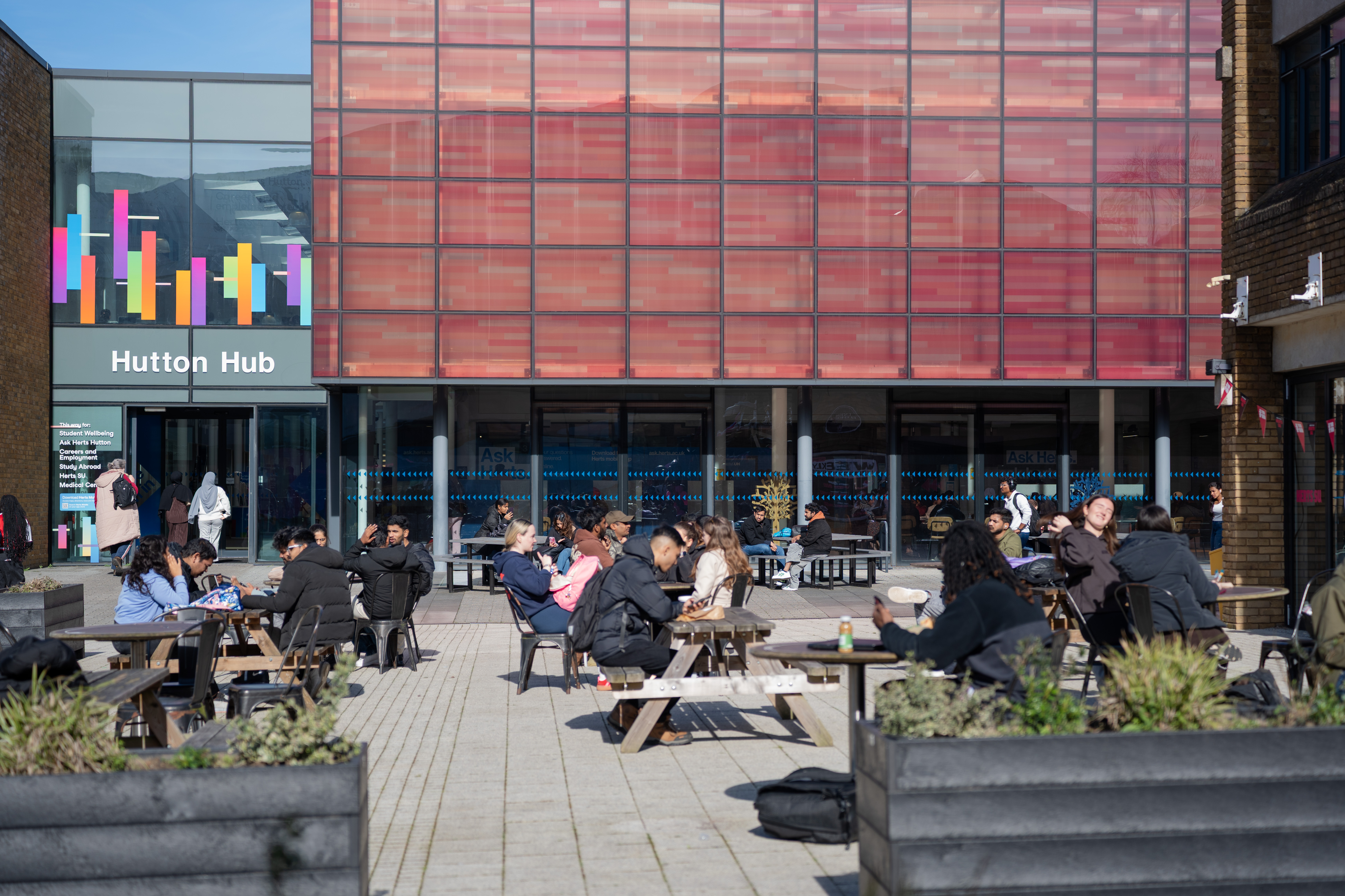 Students in the outside seating area of the elehouse